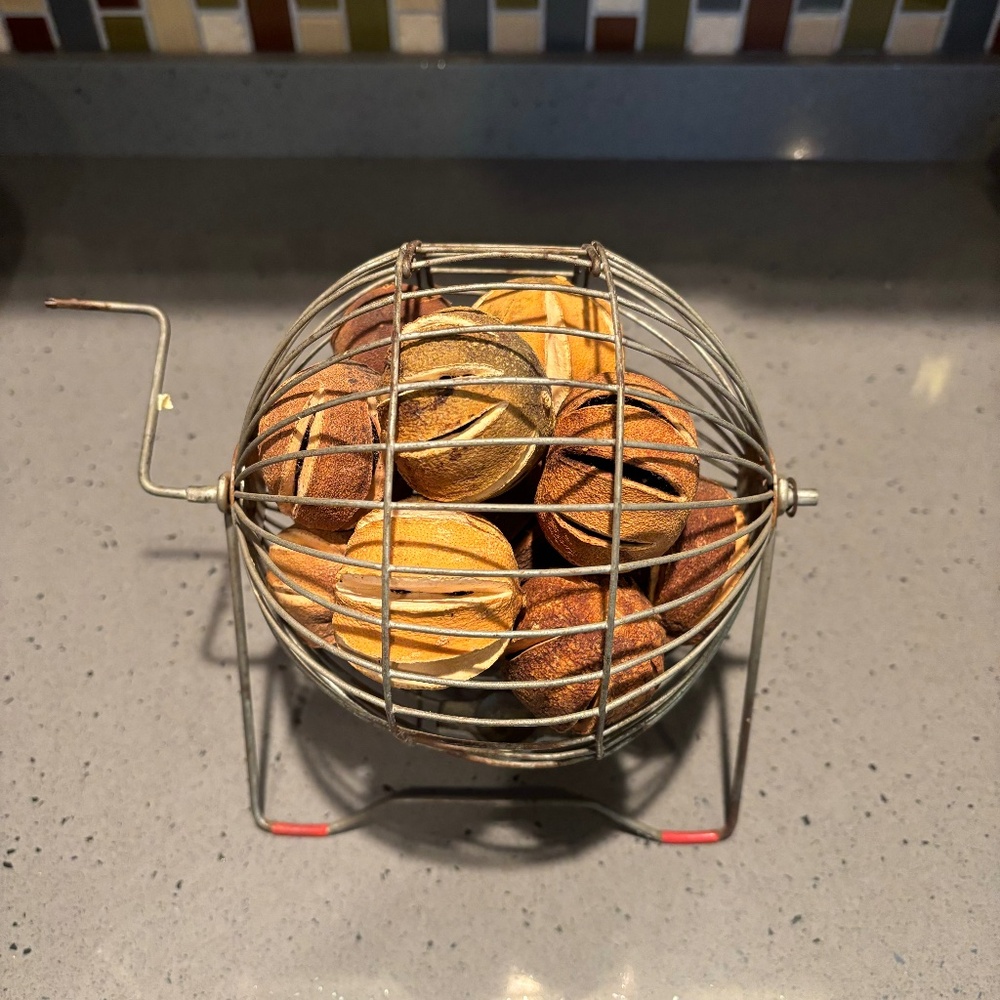 Vintage metal Bingo spinner cage with dried lemons/limes